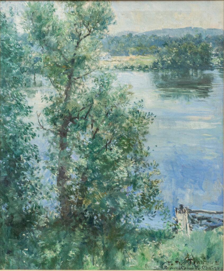 Impressionist landscape of a riverbank with dense green trees and calm water reflecting the sky.