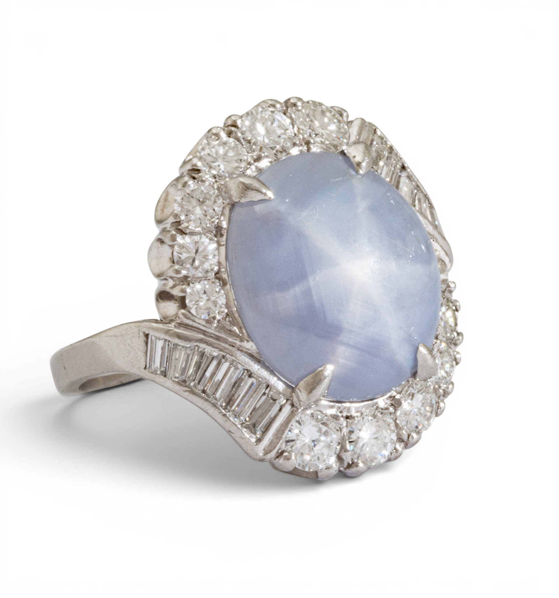 Diamond-studded ring with a pale blue oval center stone surrounded by a halo of diamonds.