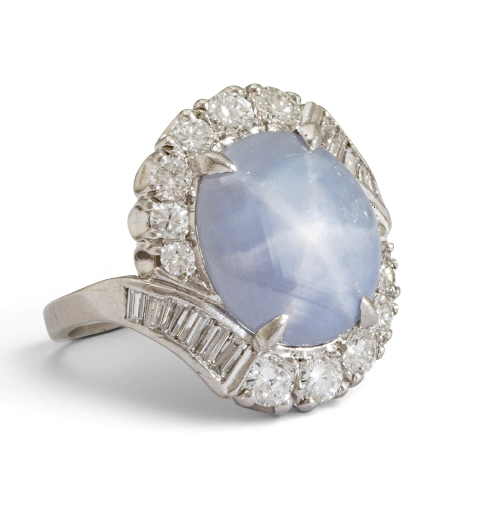 Diamond-studded ring with a pale blue oval center stone surrounded by a halo of diamonds.